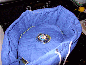 Dutch oven in cozy with dickie over outer lid.