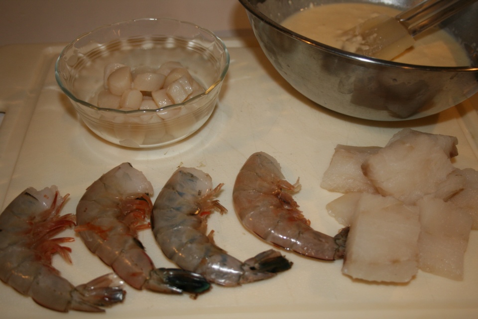 Click to enlarge - Halibut, scallops and shrimp ready to peel await battering and frying.