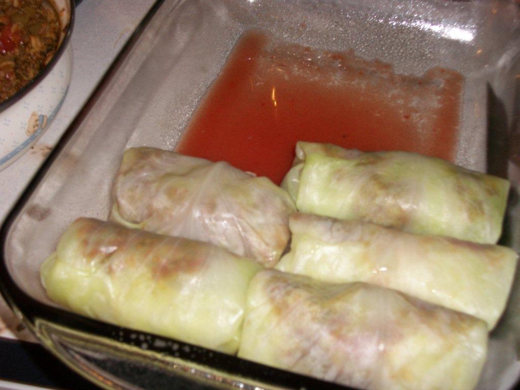 Click to enlarge - Place filled and rolled cabbage leaves in a baking dish.