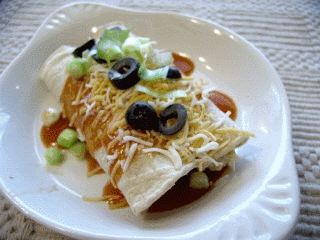 Click to enlarge - Chicken enchiladas with red chili sauce.