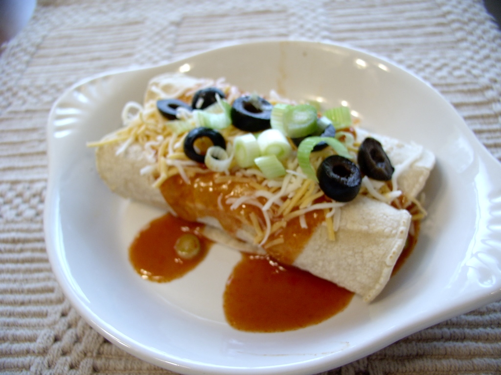 Click to enlarge - Chicken enchiladas with red chili sauce.