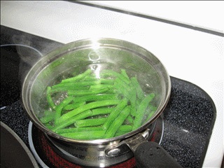 Simmer the prepared beans for 5 minutes.