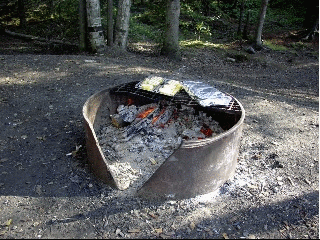 Halibut in foil cooking over the campfire coals at Eagle River Campground.