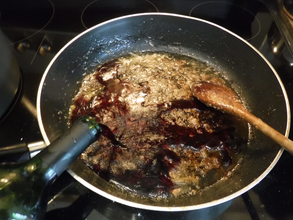 Click to enlarge - Deglaze the sauté pan with a bit of broth or red wine and scrape the brown bits off the bottom of the pan.