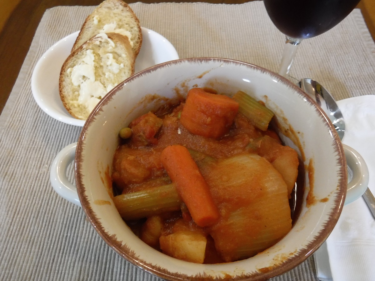 Click to enlarge - A bowl of piping hot red beef stew, some hot, freshly baked bread with a dollop of butter make a wonderful meal.