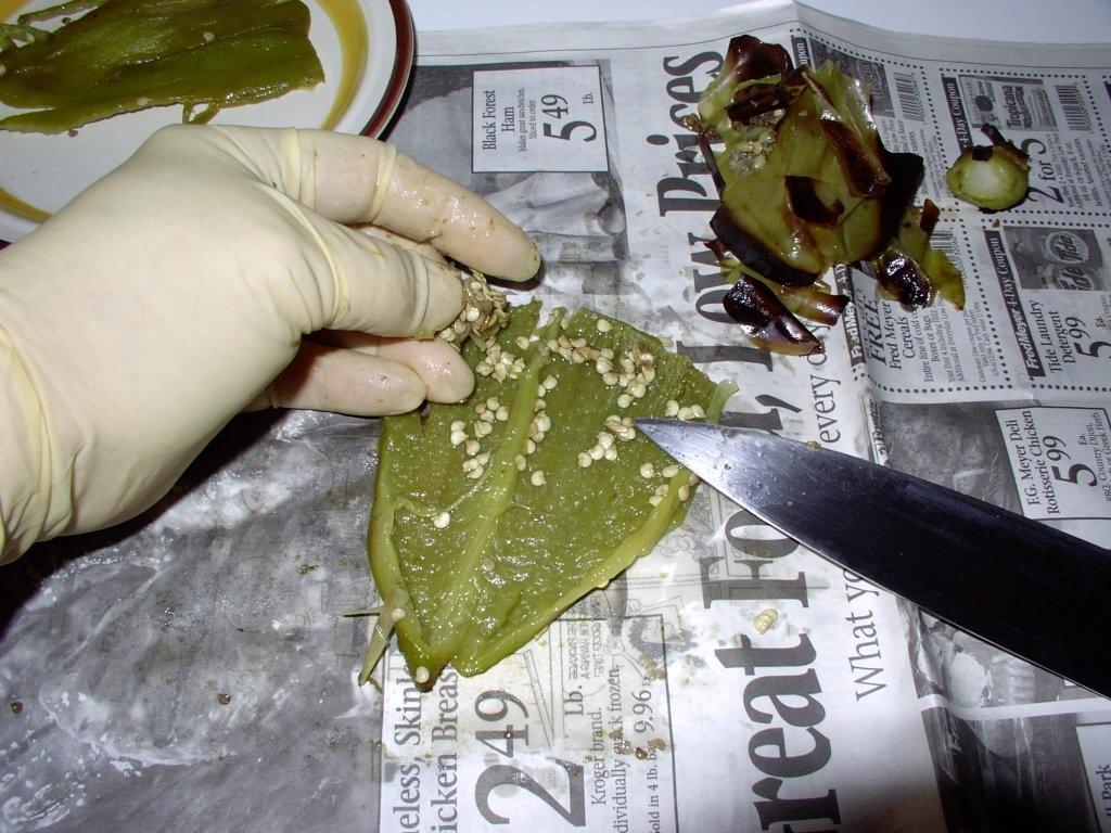 Click to enlarge - Slice open chiles and remove seeds and membranes.