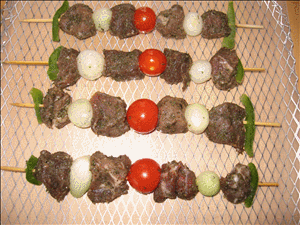 Marinated moose meat and vegetables on skewers.
