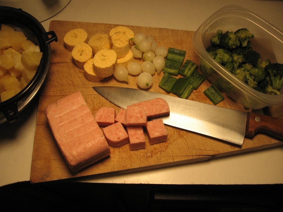 Click to enlarge - Preparing meat, fruit and vegetables for the kabob.