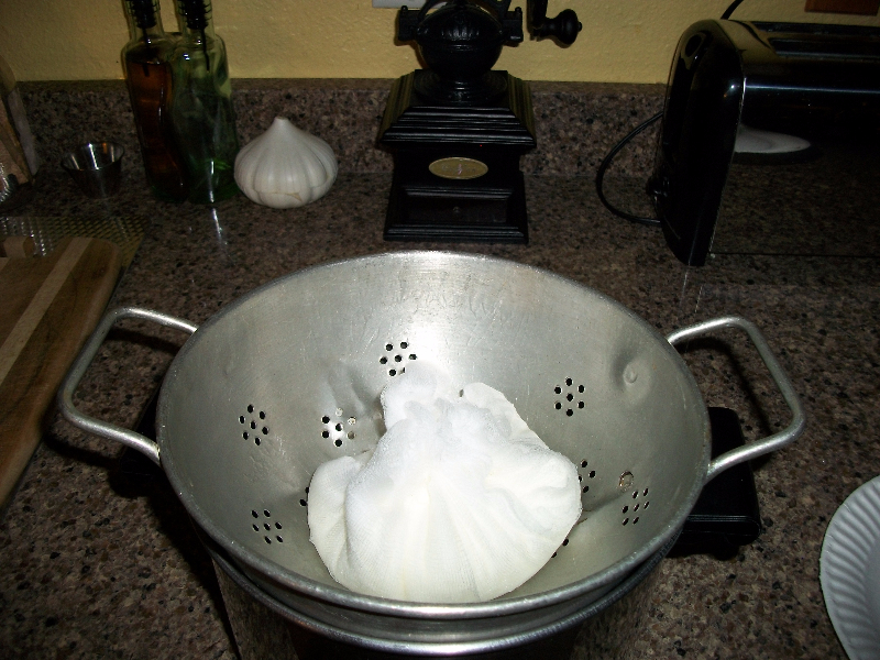 Click to enlarge - A strainer or sieve sitting in a dish or pan makes  a perfect way to make your yogurt cheese and have it all fit in the refrigerator.