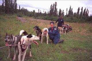 Peggy and Sonny congratulate the dogs for a good exercise run.